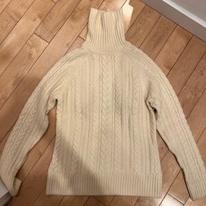 100% cashmere Brooks Brothers cream colored turtleneck with cording detail.